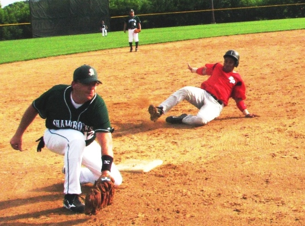 Carlos Ubiera of the Eden Prairie Lions Tap slides into a base during a game against the St. Patrick Shamrocks. Photo courtesy of Pat Thompson