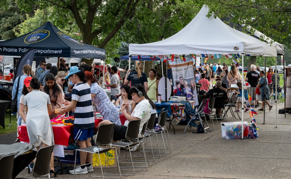Crowds at Sunday's PeopleFest Party were able to try their hand at creating Chinese characters and examine other displays, find out about hosting an exchange student, and enjoy additional exhibits and performances celebrating Eden Prairie's diversity. Photos by Jeremy Peyer 