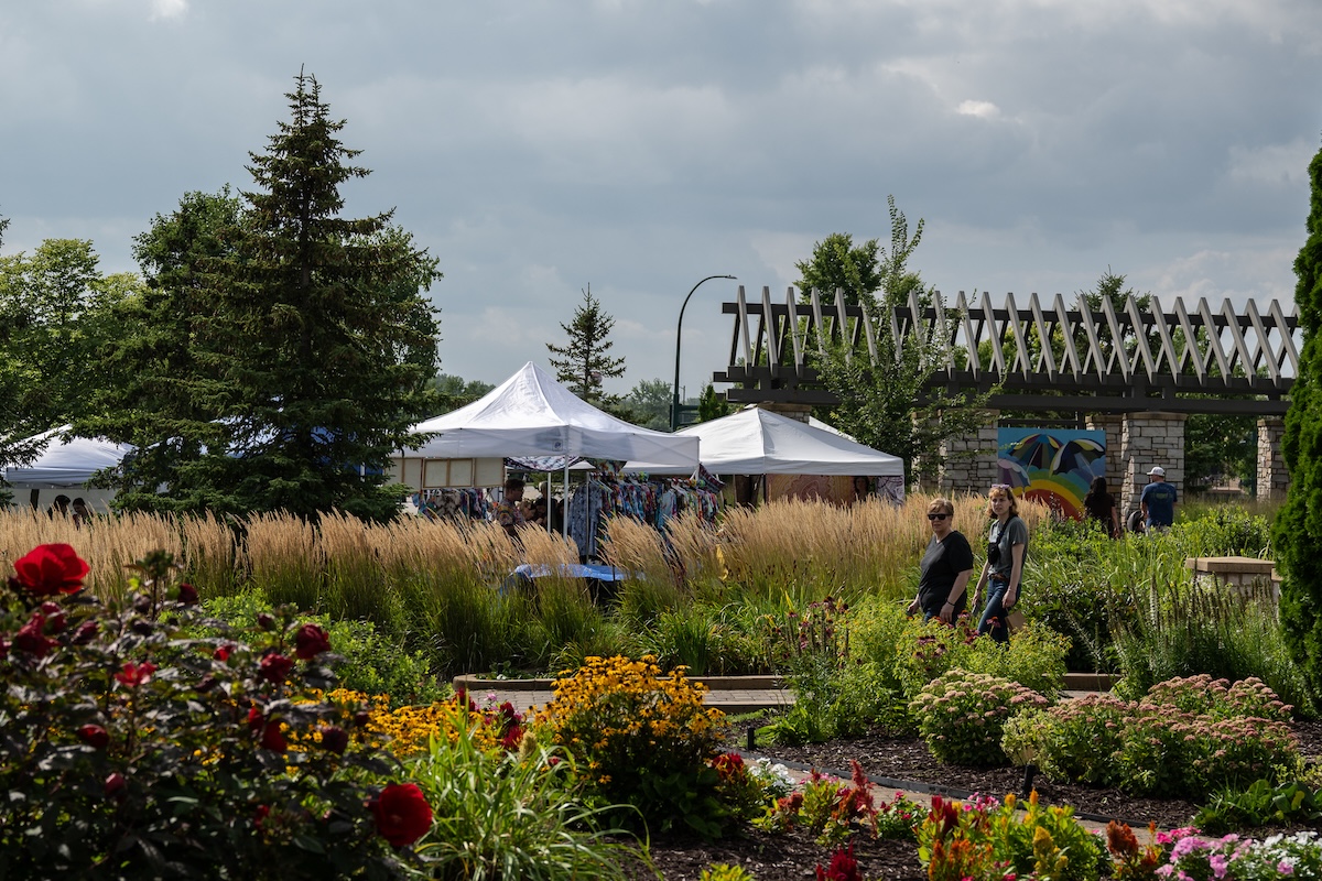 Visitors at Arts in the Park, a celebration of Eden Prairie's local art and music, enjoy a day of performances and community gathering. Photo by Jeremy Peyer