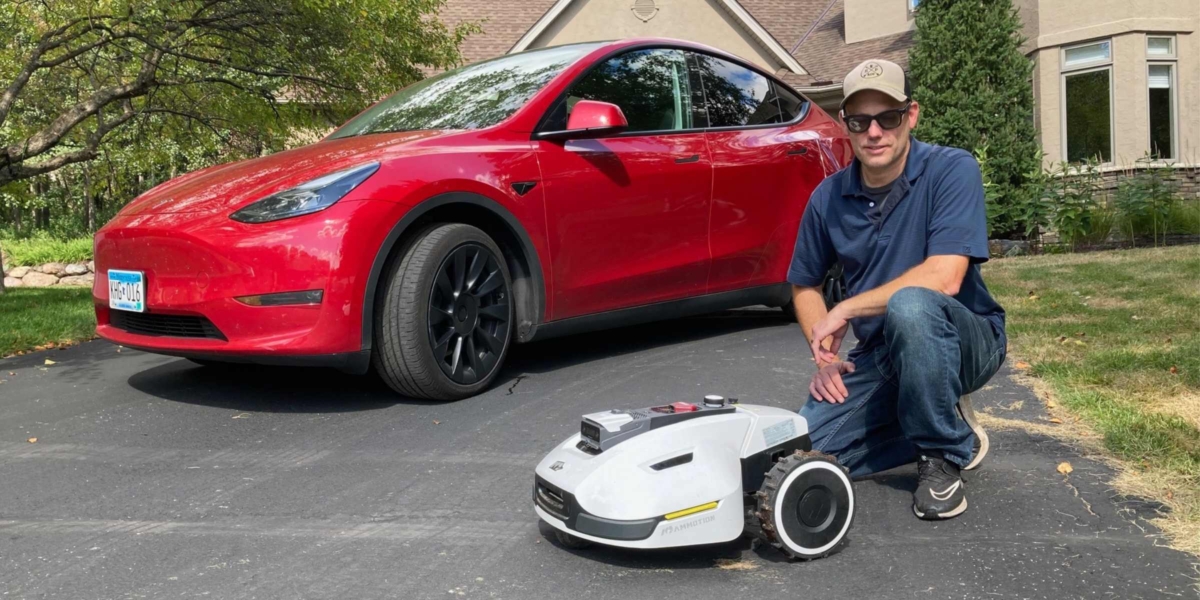 Eden Prairie resident Jeremy Hoehn is pictured with his Tesla Model Y and autonomous electric lawnmower, a Mammotion YUKA, which he’ll bring to the Sept. 10 Going Electric Showcase at Staring Lake Park. Photo by Mark Weber