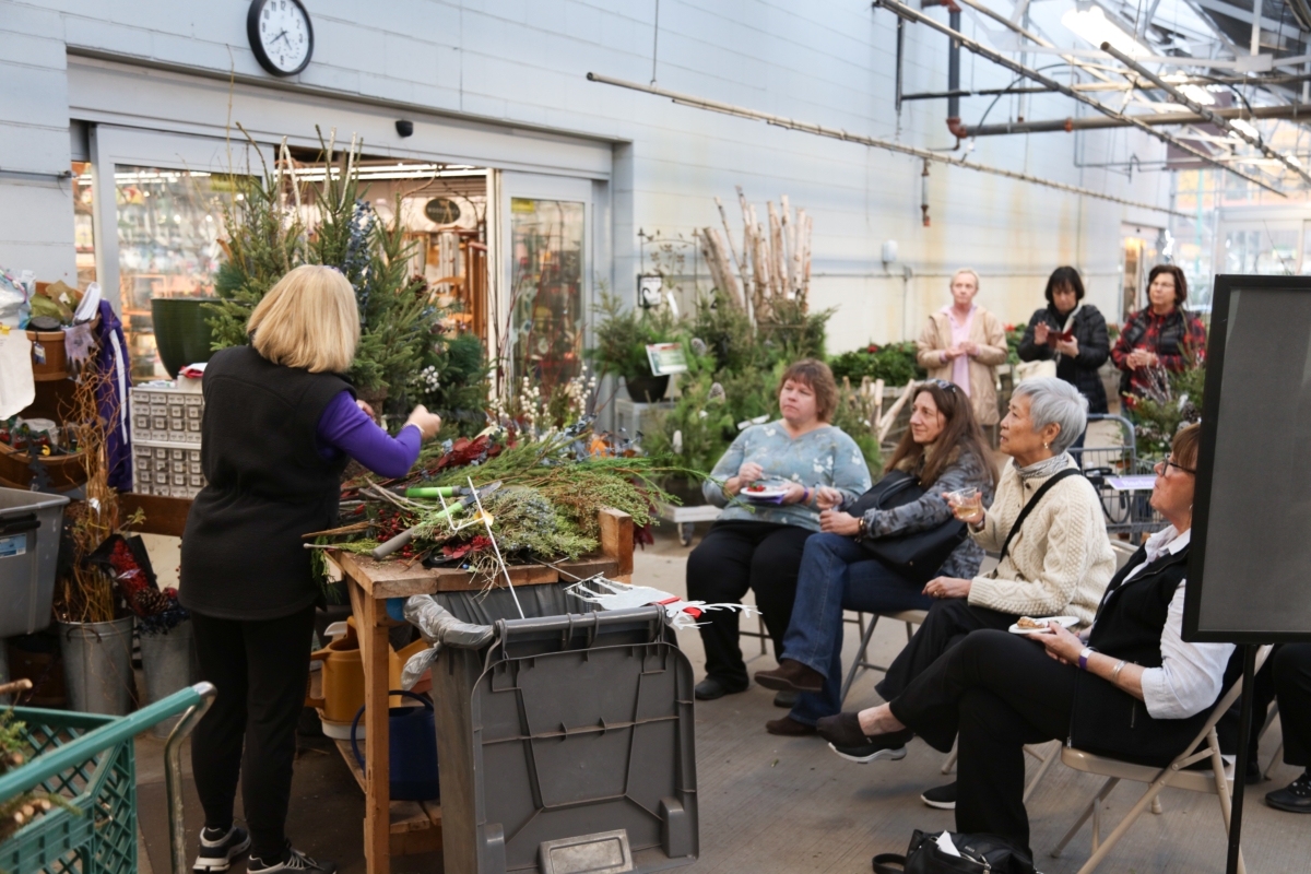 Attendees at Bachman's November Sip & Shop event watched Cyndee Ramm demonstrate how to arrange spruce tips. Photos by Maxwell Mars