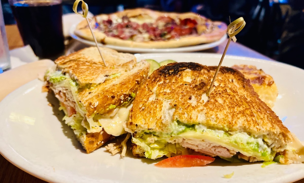 Chester’s Turkey Avocado sandwich at Tavern 4 & 5, layered with rotisserie turkey, creamy avocado, and fresh toppings on multigrain bread – a super satisfying classic. Photo by Rachel Engstrom
