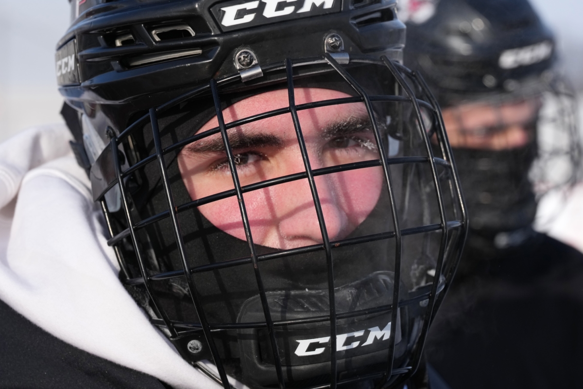 Ice built up on the eyelashes of Eden Prairie senior defenseman Blake Couet as he practiced in frigid temperatures Monday at the Hockey Day Minnesota rink at Valleyfair, where his team is set to face Hibbing on Saturday morning. Photo by Rick Olson