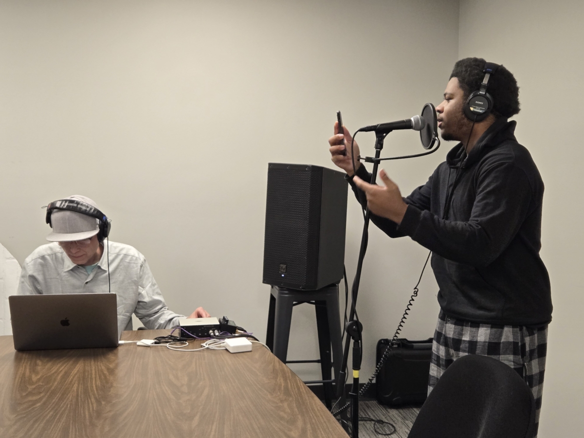 John Thomas raps original lyrics he wrote as producer Stefon “Bionik” Taylor records him for an album created by Kaleidoscope Teens.