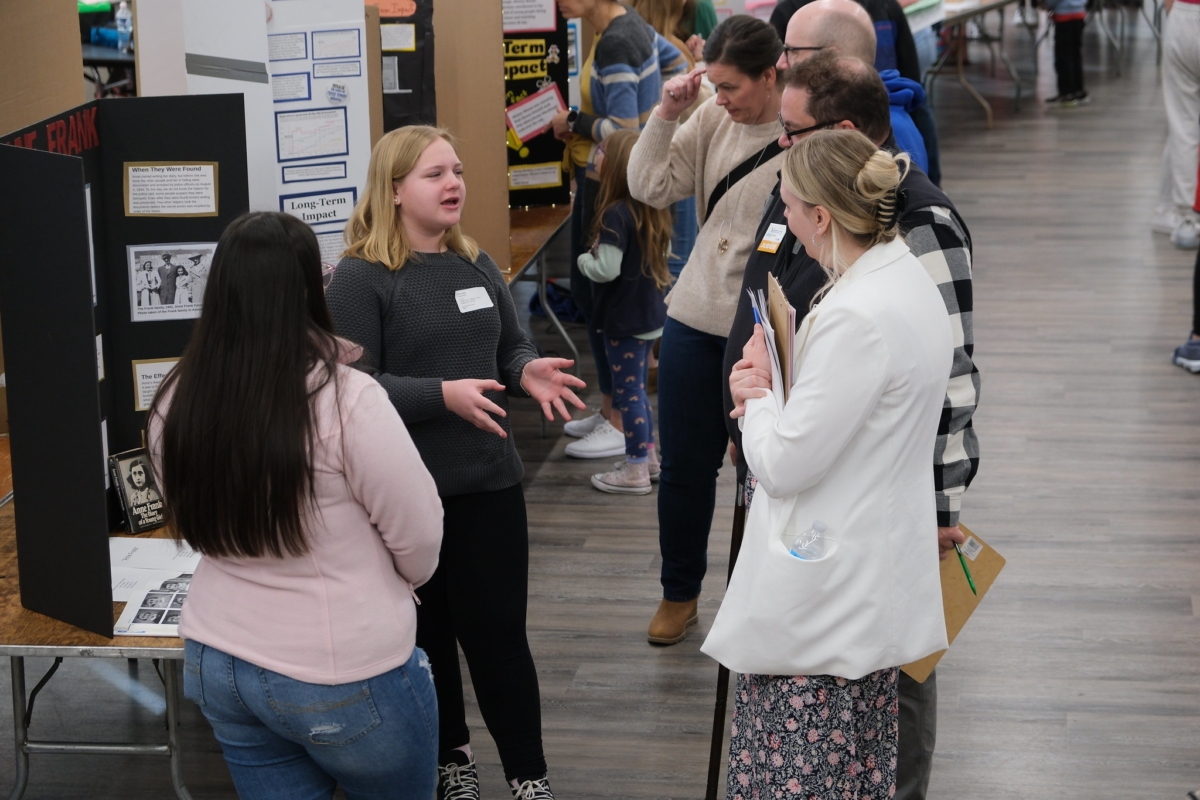 Students explaining their project to judges at the 2024 Metro Junior West contest at Central Middle School. Photo by National History Day in Minnesota