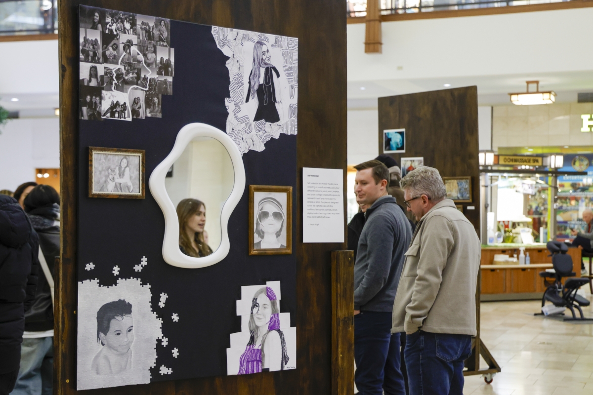 Tanya Ralph’s capstone project, titled “Self-reflection.” Her classmate Casey Dale, who was standing nearby, is reflected in the center mirror. Photo by Gillian Holte
