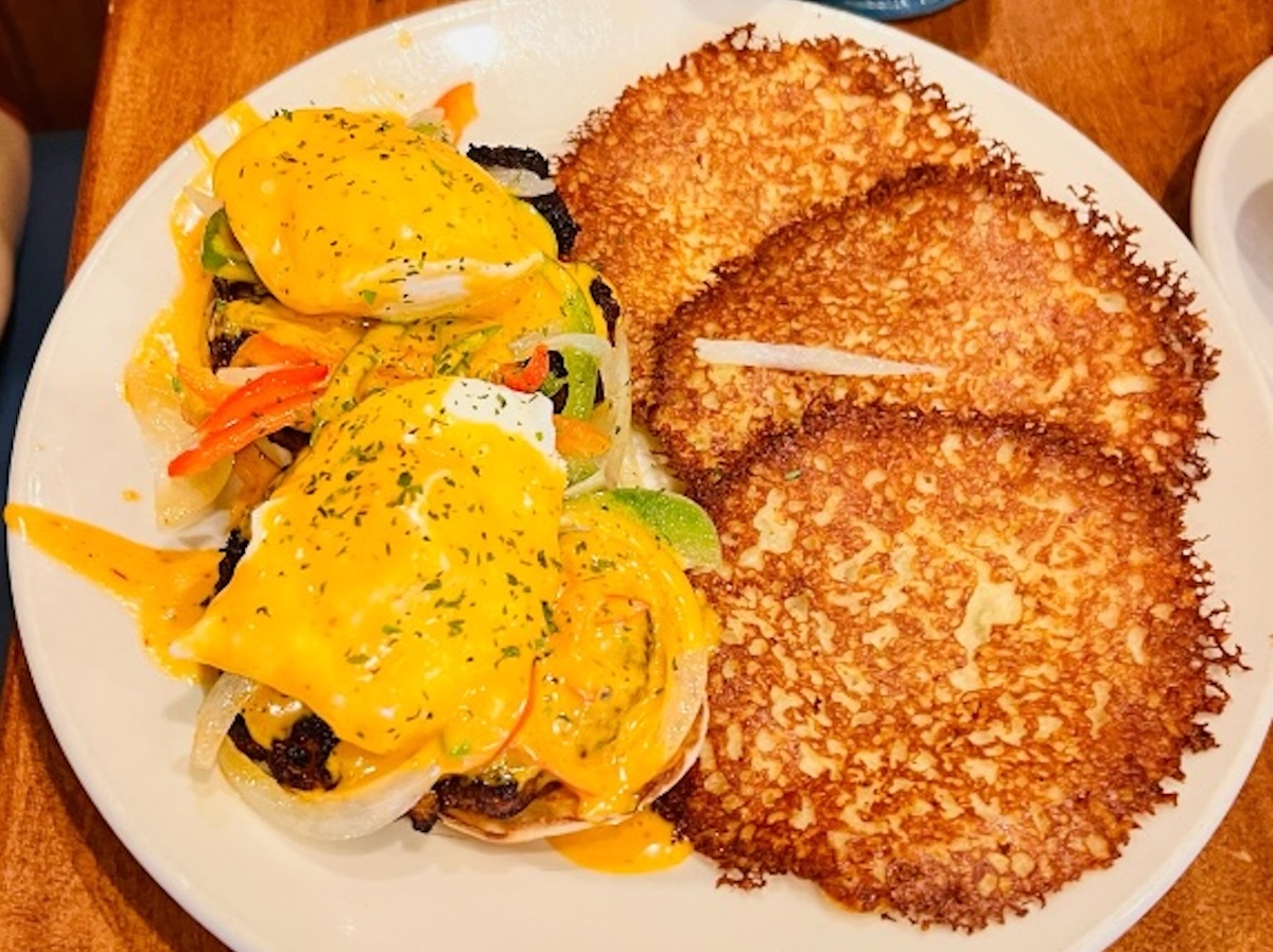 Chipotle benedict with chorizo patties, fajita vegetables, and chipotle hollandaise, served with three potato pancakes at The Original Pancake House in Eden Prairie. Photo by Rachel Engstrom