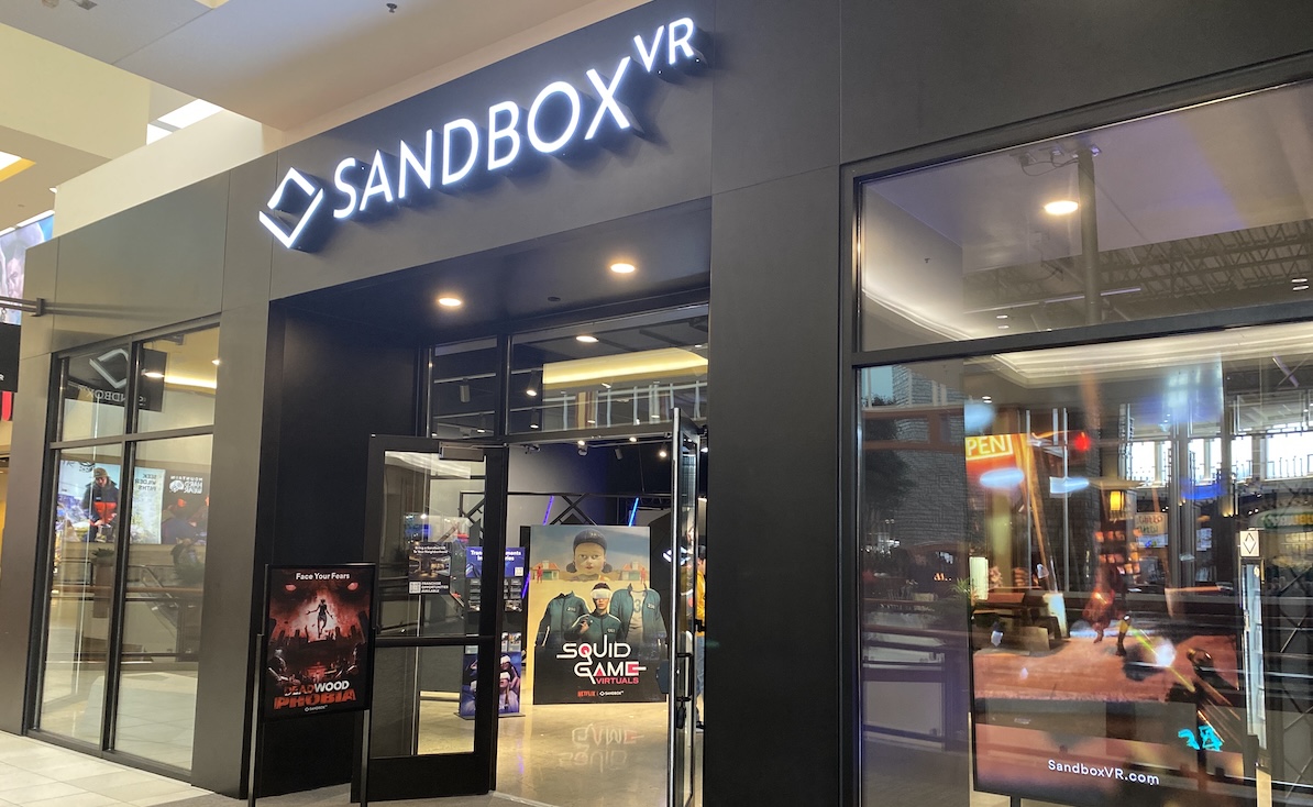 Sandbox VR at Eden Prairie Center offers immersive virtual reality experiences, including “Squid Game Virtuals” and “Deadwood Valley.” The venue, located on the second level near Scheels and AMC Theatres, features multiple holodecks and haptic technology that enhances gameplay.