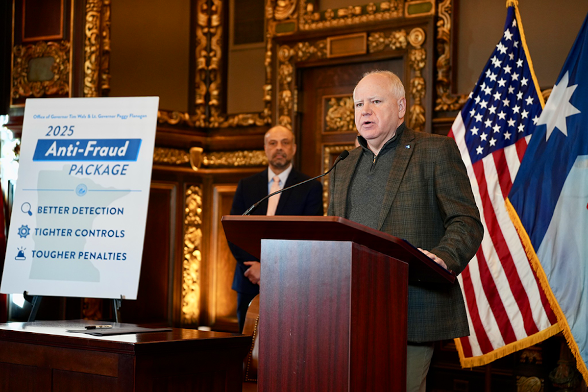 Gov. Tim Walz speaking about anti-fraud initiatives on Jan. 3. Behind him is Tarek Tomes, commissioner of IT services. Credit: Office of the Governor
