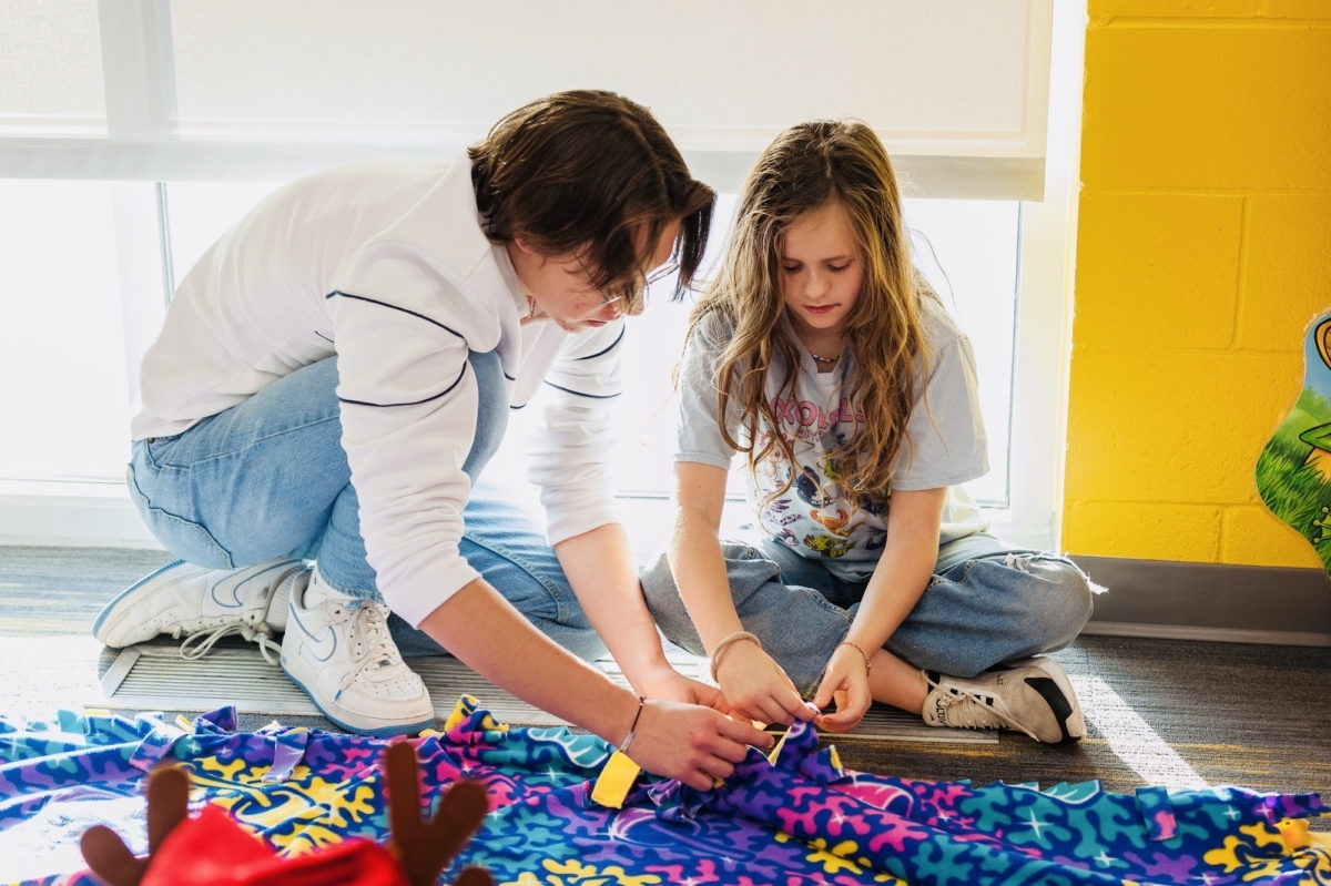 ISM students tied fleece blankets for Gillette Children's Hospital. Photo by International School of Minnesota
