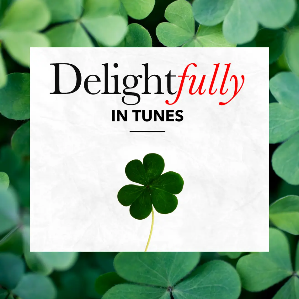 Delightfully in Tunes graphic with shamrocks
