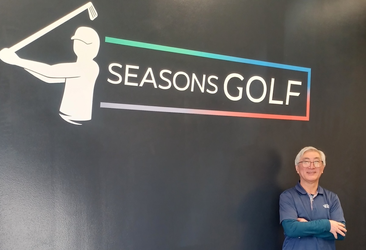 Jae Park, owner of 4 Seasons Golf in Eden Prairie, stands inside the facility he opened in January 2024. The business features eight golf simulator bays, leagues, and lessons aimed at creating a year-round indoor golf community.