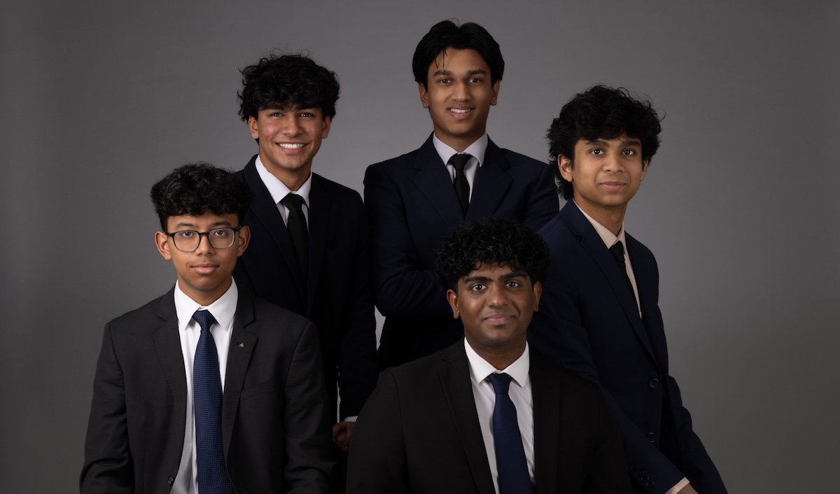 From left: Devarsh Borah (on stool), Devanshu Shah (standing), Paras Nemani (center), Spandan Datta (far right), and Nithin Palani (seated). Photo by Steve Silverman