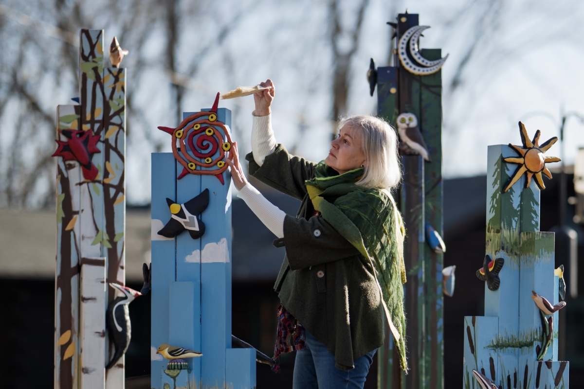 Ceramic artist Susan Feigenbaum works on “BirdScapes,” a public art installation at Eden Prairie’s Outdoor Center. Created in collaboration with painter Megan Moore, the piece depicts Minnesota bird species and their habitats. Installed in May 2021, it is part of Eden Prairie’s public art collection.
