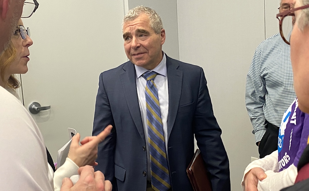 State Rep. Steve Cwodzinski (DFL-49, Eden Prairie) speaks with attendees after a March 8 legislative forum.