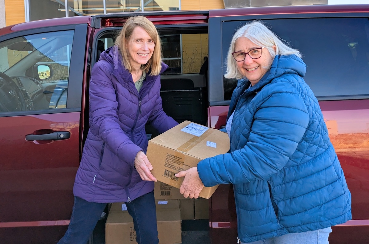 From left, Nancy Loewen and Linda Hayen load up boxes of books to send to every representative in Washington, D.C. Photo courtesy of Nancy Loewen