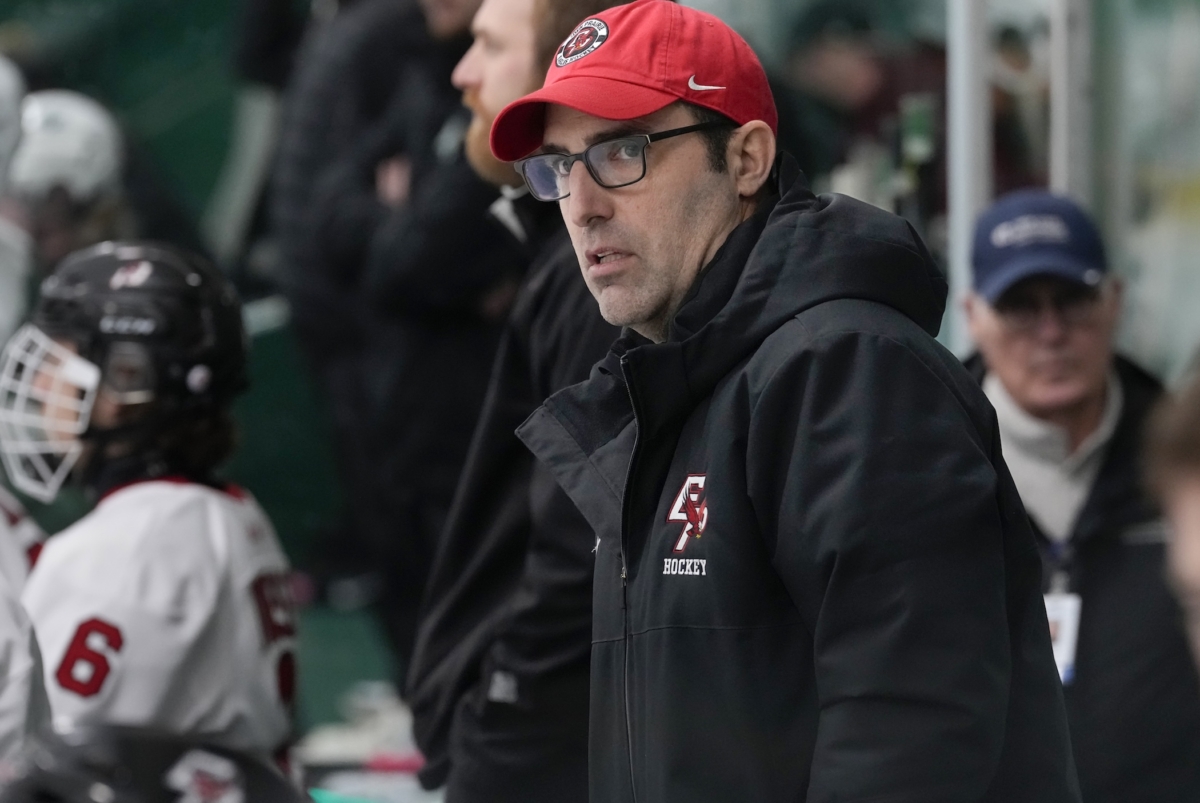 den Prairie head coach Mike Terwilliger behind the bench during the Eagles’ 5-2 loss to Holy Family in the Section 2AA semifinals at Braemar Arena on Feb. 22. Terwilliger resigned on March 14 after three seasons leading the team. Photo by Rick Olson