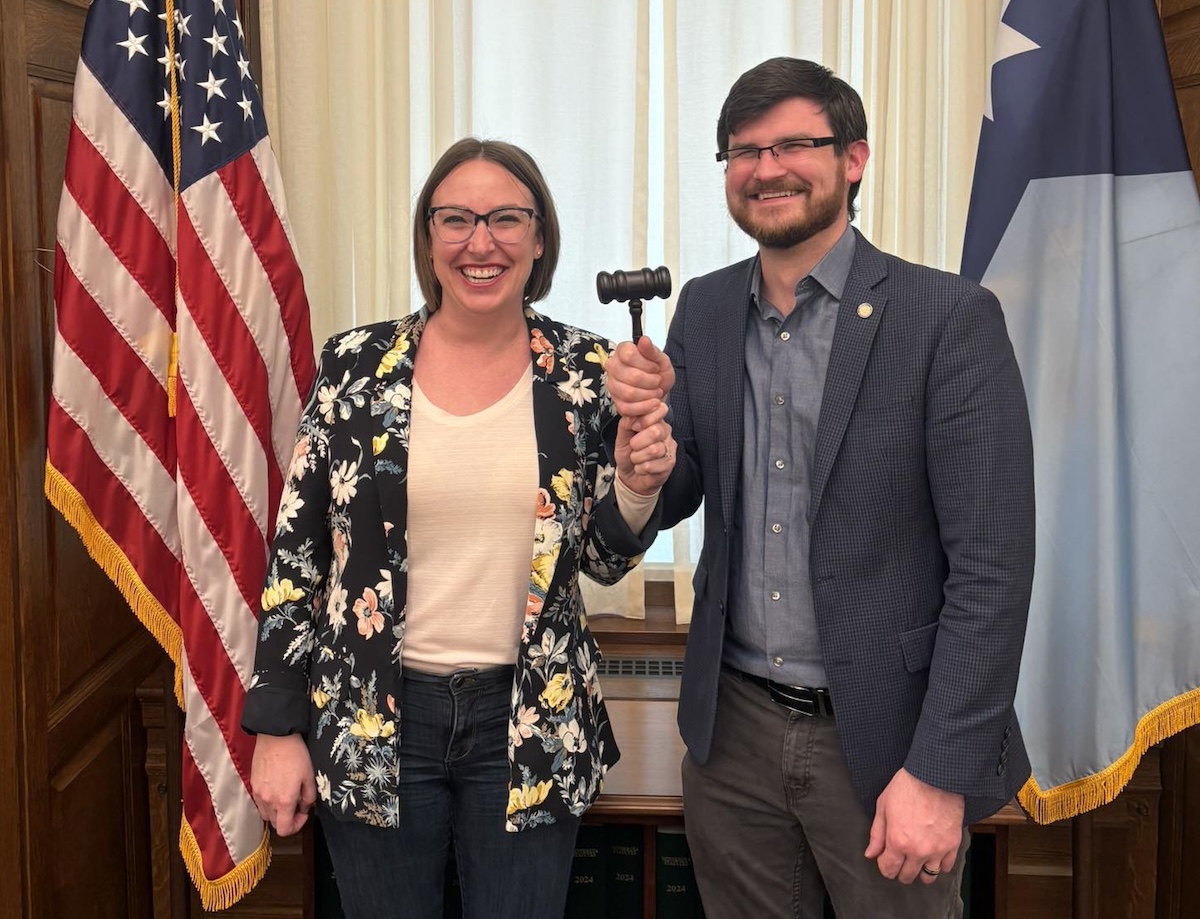 Rep. Carlie Kotyza-Witthuhn (DFL-49B, Eden Prairie), left, and Rep. Nolan West (R-32A, Blaine) share the gavel as co-chairs of the Minnesota House Children and Families Finance and Policy Committee in a photo Kotyza-Witthuhn posted to Facebook on March 19. Credit: Carlie Kotyza-Witthuhn via Facebook
