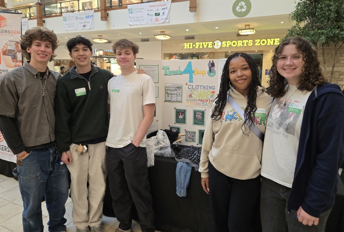 Threads for Change members Gabe Hernandez, Derrick Srun, Aidan Harris, Kendall Jones and Nadia Guidarini educate the public about upcycling clothing at the Eden Prairie Eco Expo. Photo by Renee Rushdy