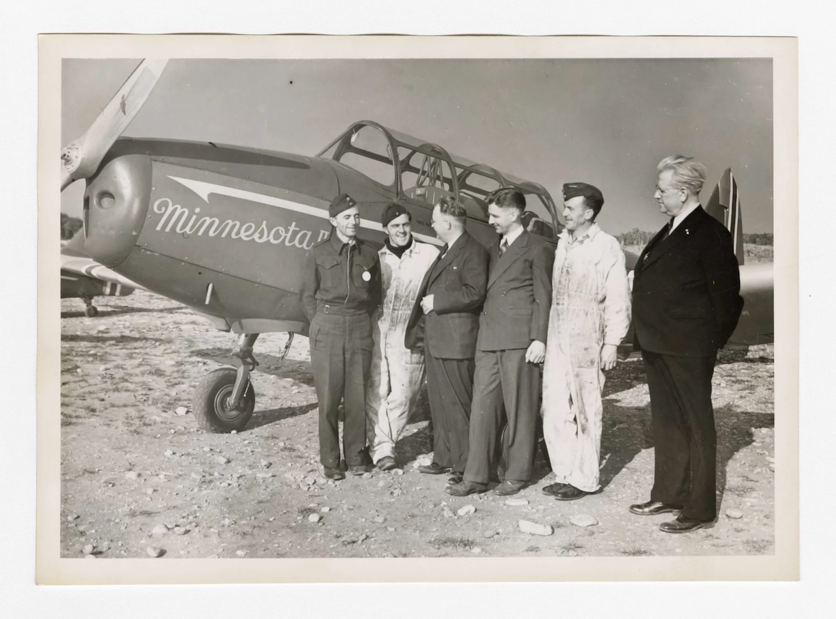 In this photo, Camp Little Norway Association board members and others are visiting Camp Little Norway on October 1-3, 1943. Camp Little Norway Association was started in Minneapolis by Norwegian-Americans. Some of the people included in the photo are Jacob Stefferud (chief clerk for the Norwegian America Line and consul for Norway), Albert Lindholm (importer of Norwegian fisheries products), Richard Larson (an executive at Honeywell Heat Regulator Company), and Dr. Sverre Nordborg (Professor of Philosophy at the University of Minnesota).