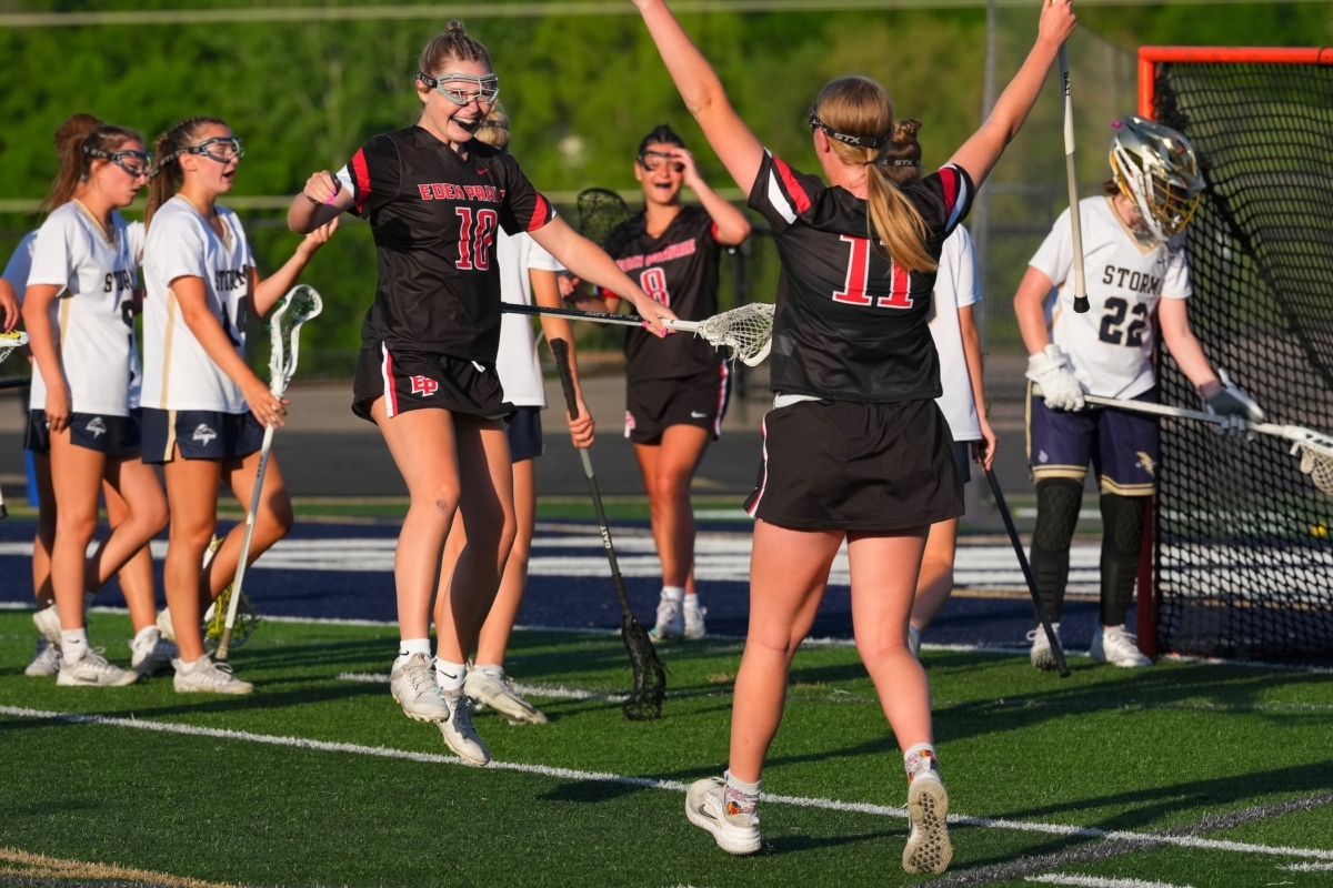 Eden Prairie junior midfielder Allie Dahl (10) celebrates after scoring her first varsity goal Monday, giving the Eagles an early 1–0 lead against Chanhassen. She is greeted by junior attacker Sara David (11), while senior midfielder Macey Haase (8) appears in the background.