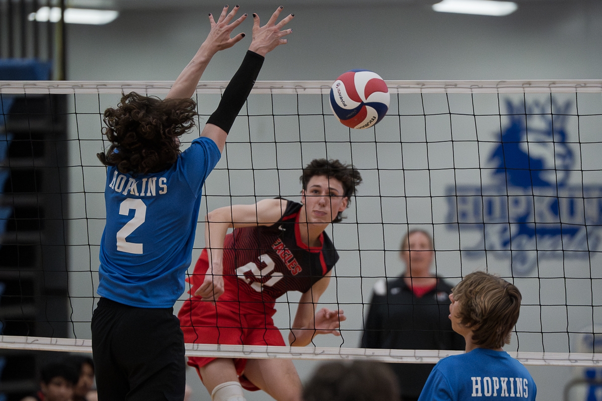 Eden Prairie senior captain Deion Lange hits the ball past a Hopkins defender during a 3-0 road win on May 20.