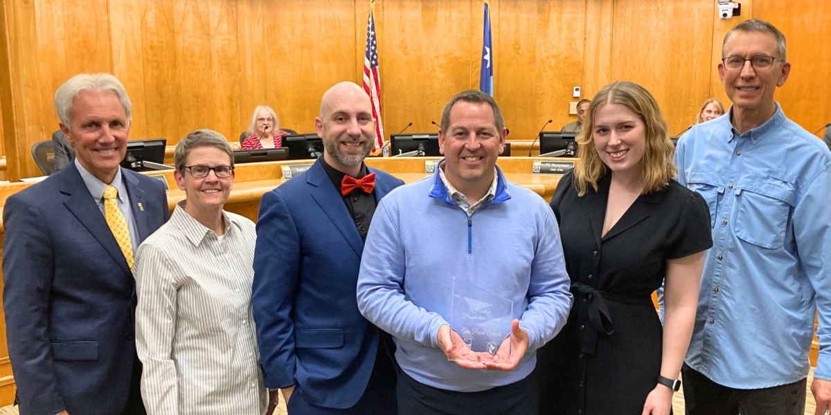 From left, Eden Prairie Mayor Ron Case, city senior planner Beth Novak-Krebs, Eden Prairie Schools executive director of marketing and communications Dirk Tedmon, Superintendent Josh Swanson, director of marketing and communications Grace Becker, and Heritage Preservation Commission member Rod Fisher are pictured Tuesday during the presentation of a Heritage Preservation Award to Eden Prairie Schools.