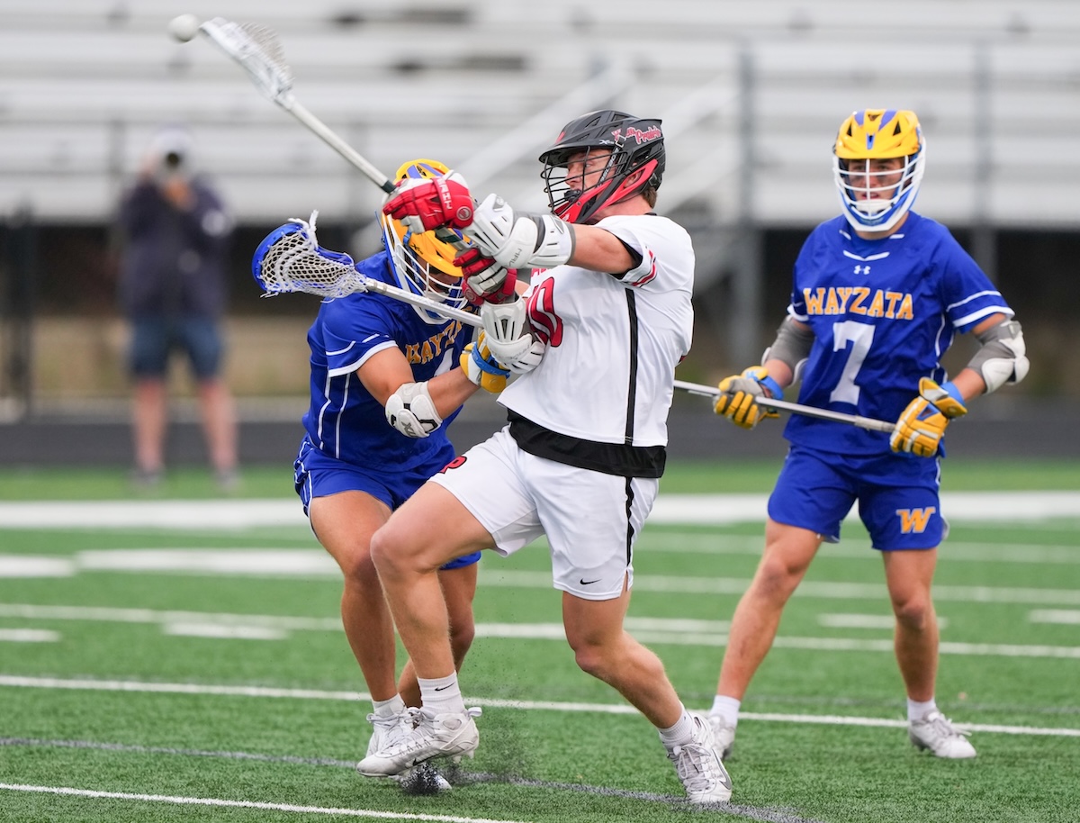 Eden Prairie senior midfielder Johnny Kleis (10) battles through Wayzata’s defense for a shot on goal in the second half of Thursday’s game. Photo by Rick Olson