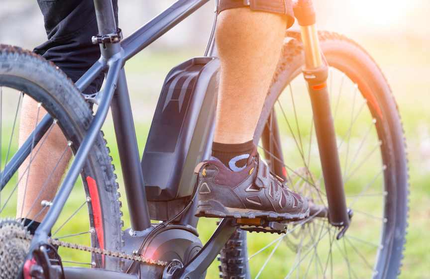 A rider on an electric bicycle. Cities across Minnesota, including Eden Prairie, are weighing how to address rising concerns about e-bike use.