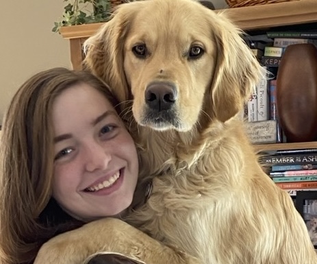 Eva Potvin is pictured with a golden retriever.