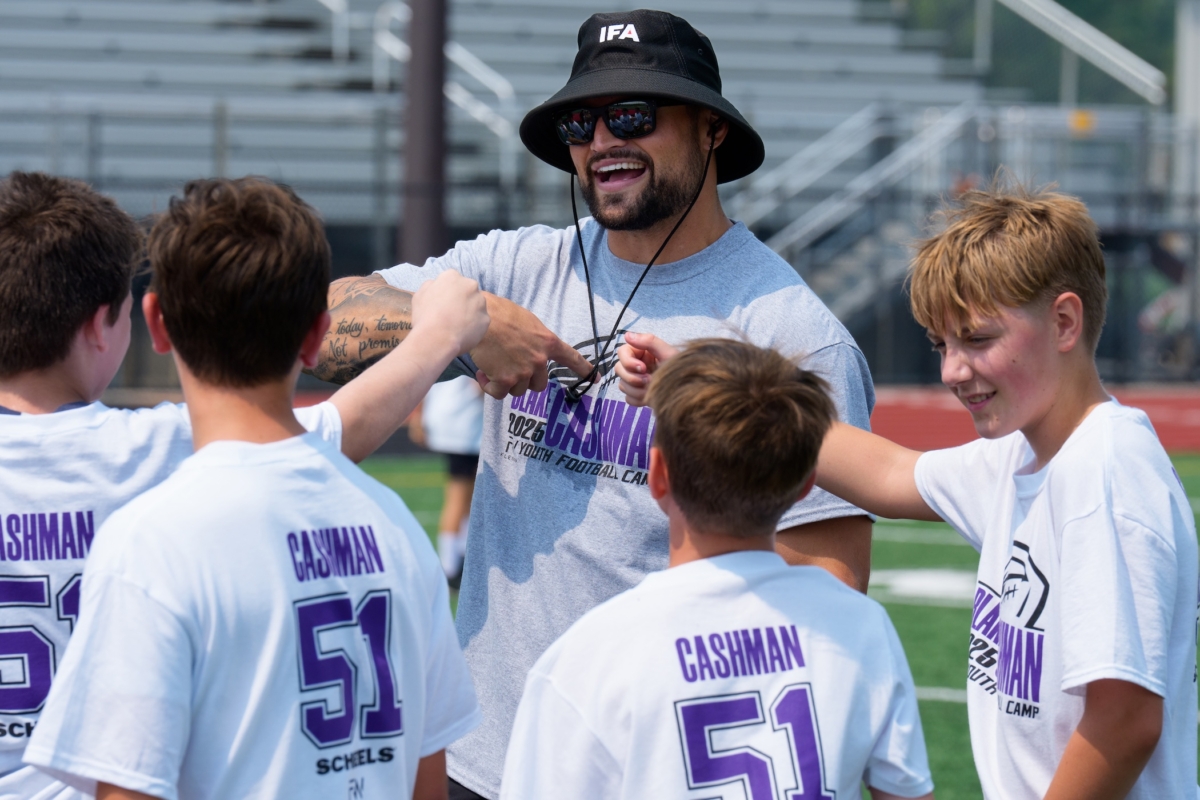Minnesota Vikings linebacker Blake Cashman stands with campers during his youth football camp Saturday at Eden Prairie High School’s Aerie Stadium – the field where he became a standout prep player. Photo by Rick Olson