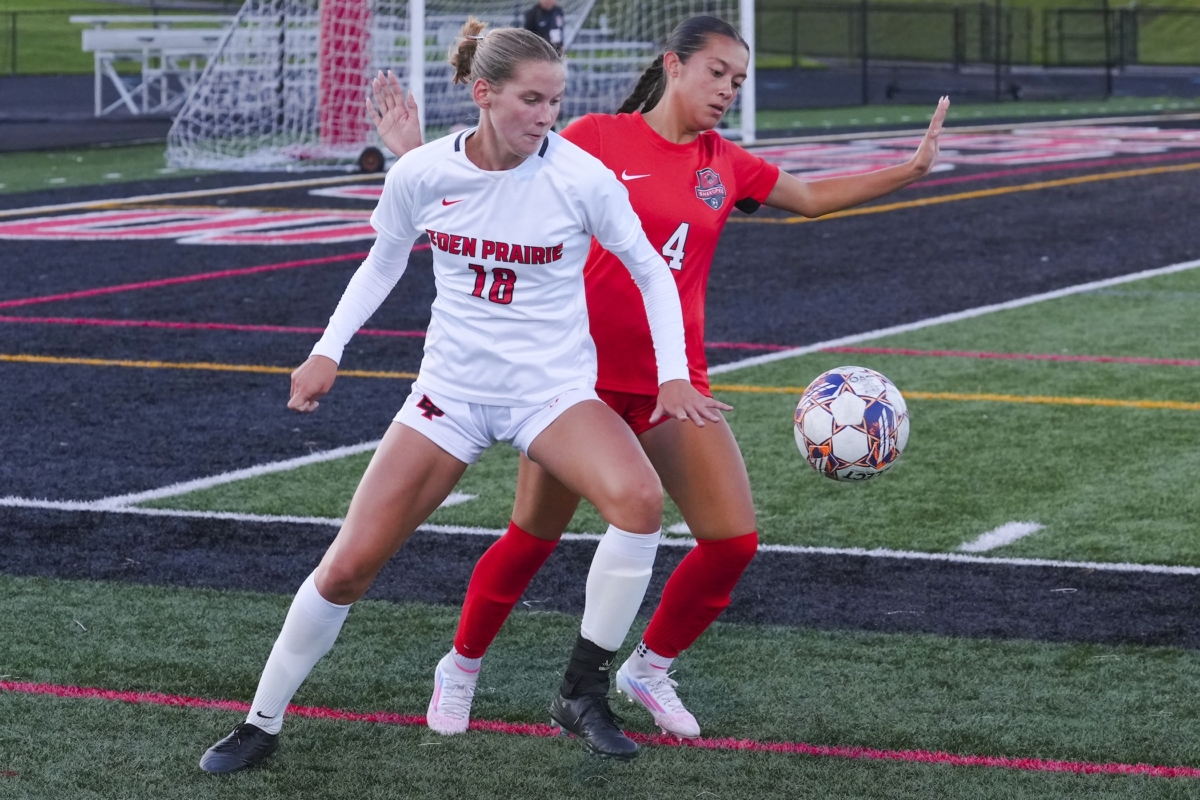 Eden Prairie’s Julia Ziesel (18) battles a Shakopee player for the ball during Saturday’s 2-1 loss at Shakopee West Middle School Stadium.