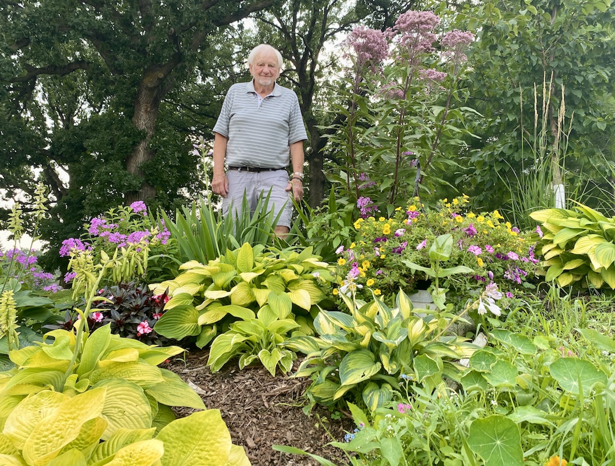 Don Peterson, 86, stands behind the garden he created at Eden Prairie Senior Living.
