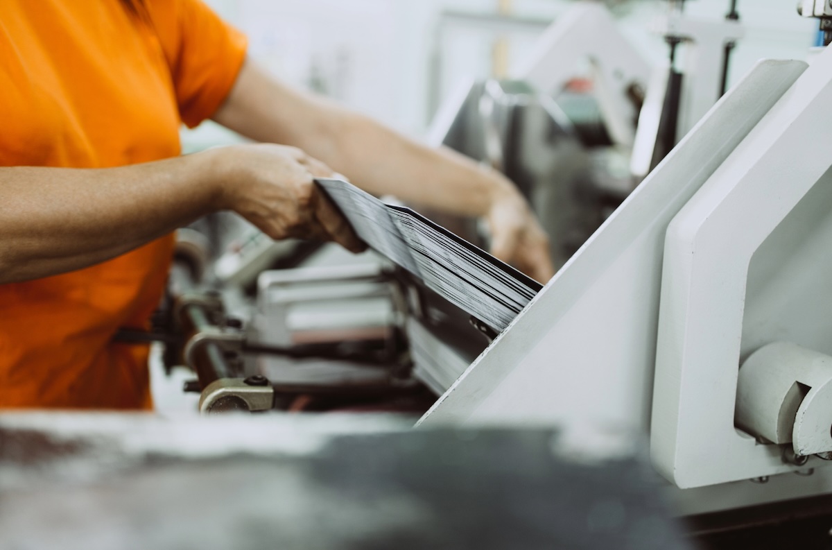 A factory worker operates a machine on a production line. Data from manufacturing is among the economic measures tracked by the Bureau of Labor Statistics.