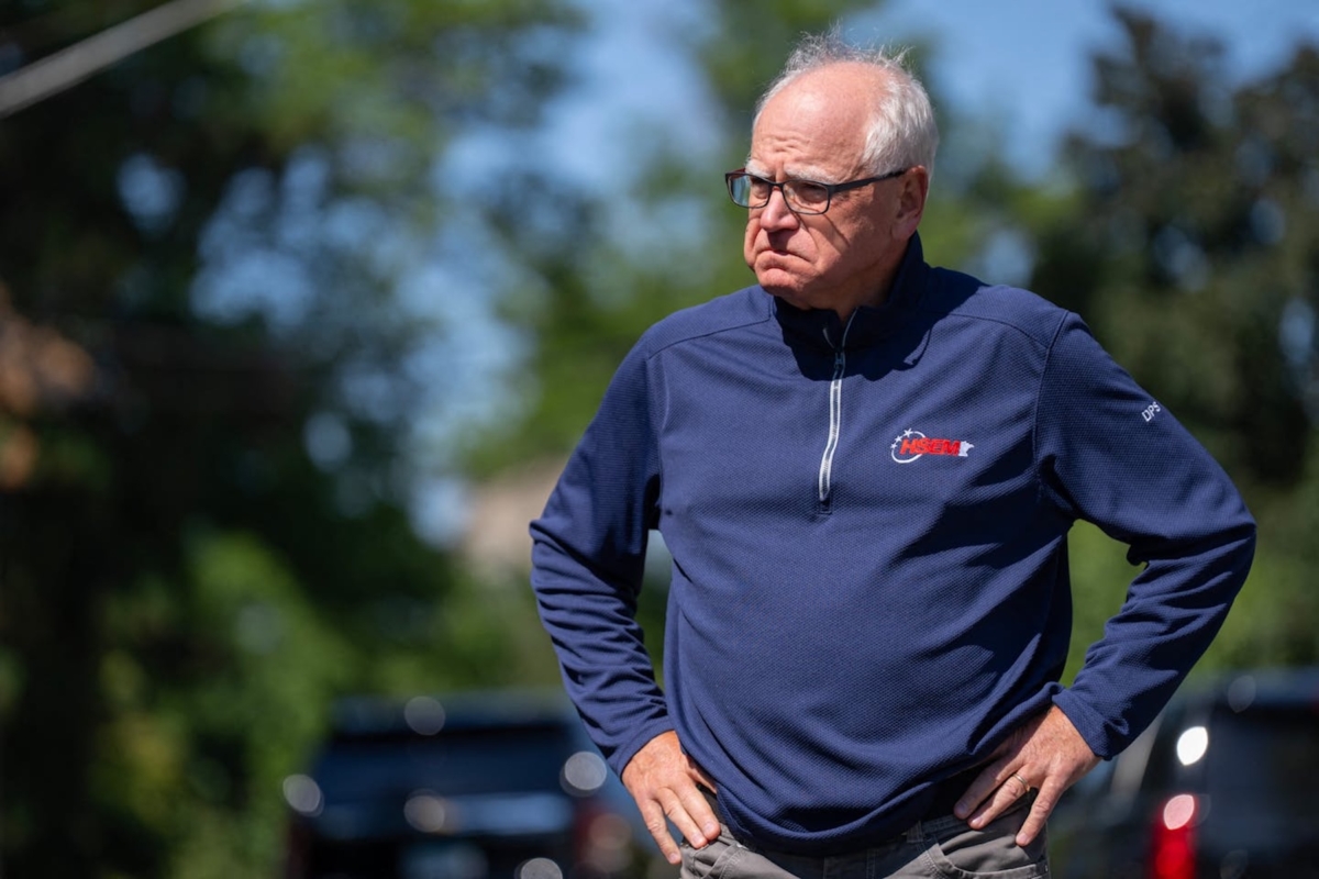 Minnesota Gov. Tim Walz waits to speak outside Annunciation Catholic Church and School in Minneapolis after a mass shooting Aug. 27. (Source: Alex Kormann/Minnesota Star Tribune via Reuters/TNS/ABACAPRESS.COM)