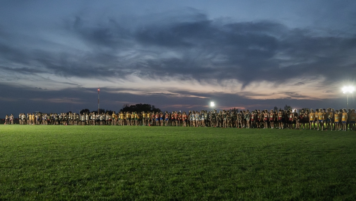 Boys varsity runners line up at the start of the Metro Invitational on Sept. 13 at Flying Cloud Fields in Eden Prairie. The meet, the largest in Minnesota, drew more than 2,000 athletes and featured nighttime races under the lights.