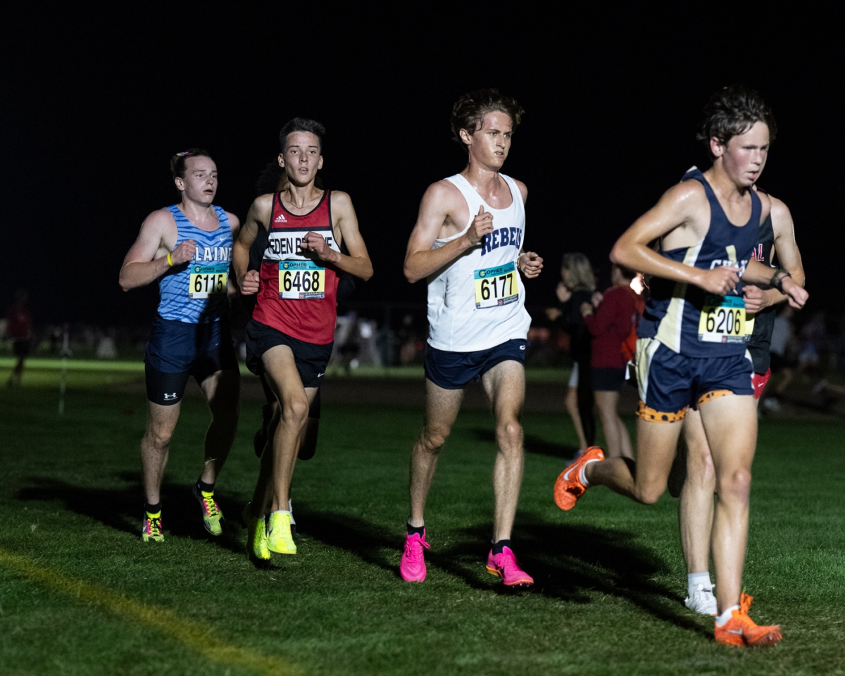 Eden Prairie eighth grader Ben Donaldson (second from left) runs with the pack during the Metro Invitational on Sept. 13 at Flying Cloud Fields. Donaldson placed 80th in the varsity boys’ 5,000-meter race, part of a meet that drew more than 2,000 athletes under the lights.
