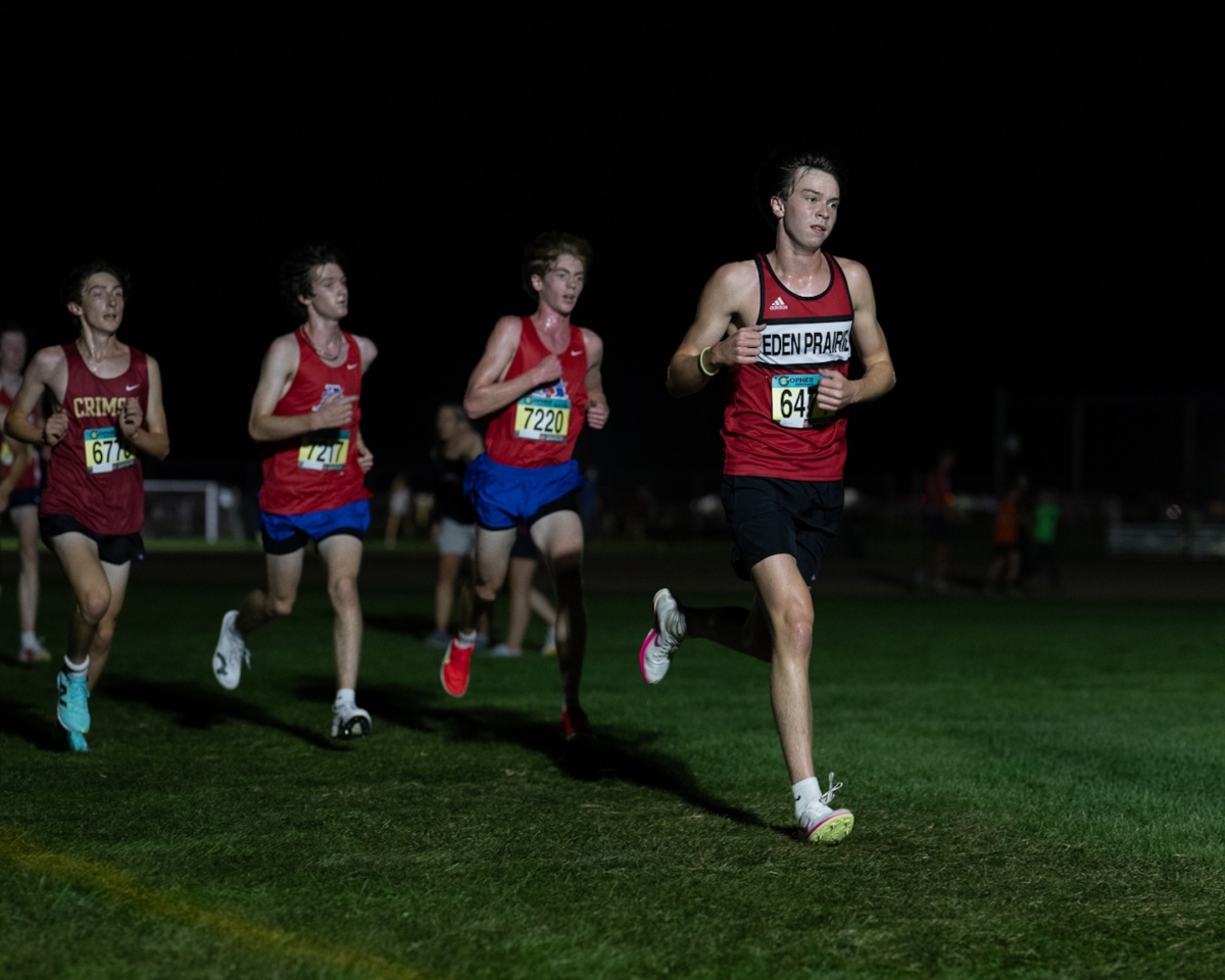 Eden Prairie junior George Hansen (6474) runs ahead of other competitors during the Metro Invitational on Sept. 13 at Flying Cloud Fields. Hansen went on to place 76th in the varsity boys’ 5,000-meter race, part of a meet that drew more than 2,000 athletes under the lights.