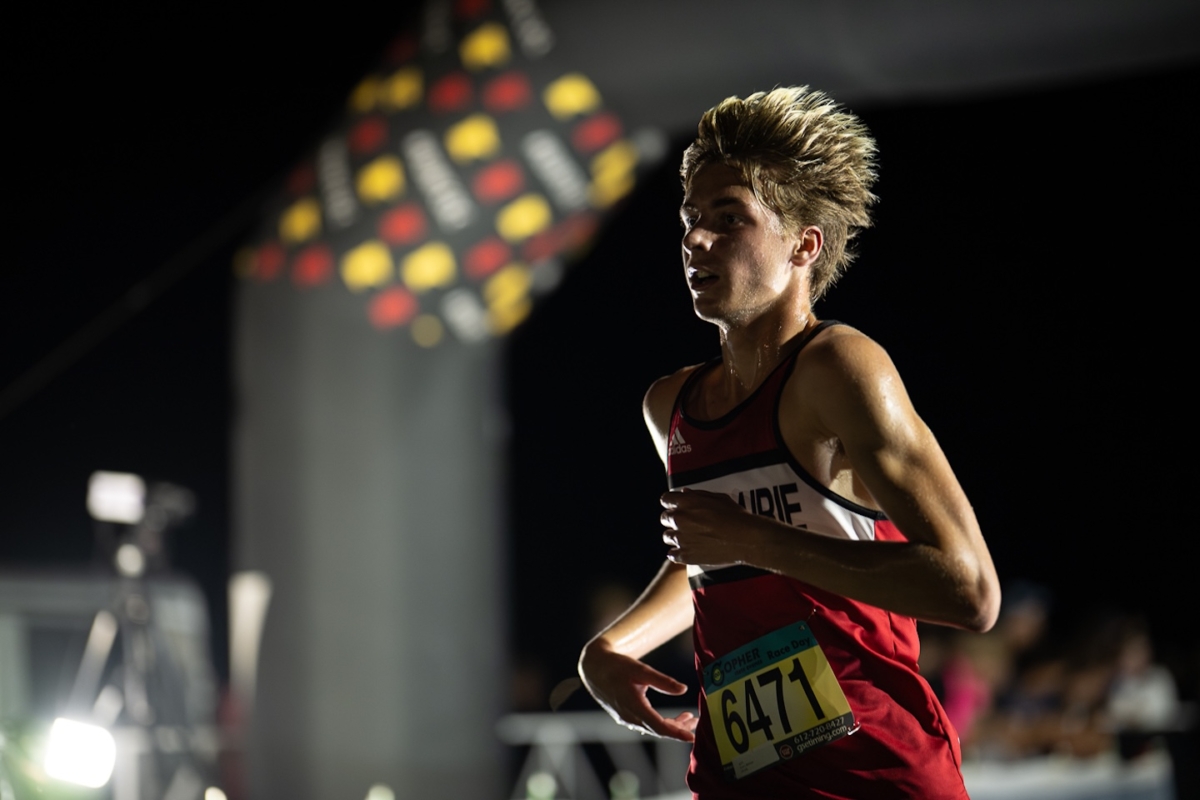 Eden Prairie sophomore Benson Farm competes in the Metro Invitational on Sept. 13 at Flying Cloud Fields. The nighttime cross country meet featured more than 2,000 runners from across Minnesota.