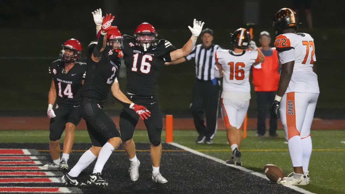 Eden Prairie's Quaid Johnson (16) Isaiah Kelly (2) and Mason Hemmesch (14) celebrate a game-winning stop on a two-point conversion against Moorhead on Friday, Oct. 3, 2025.