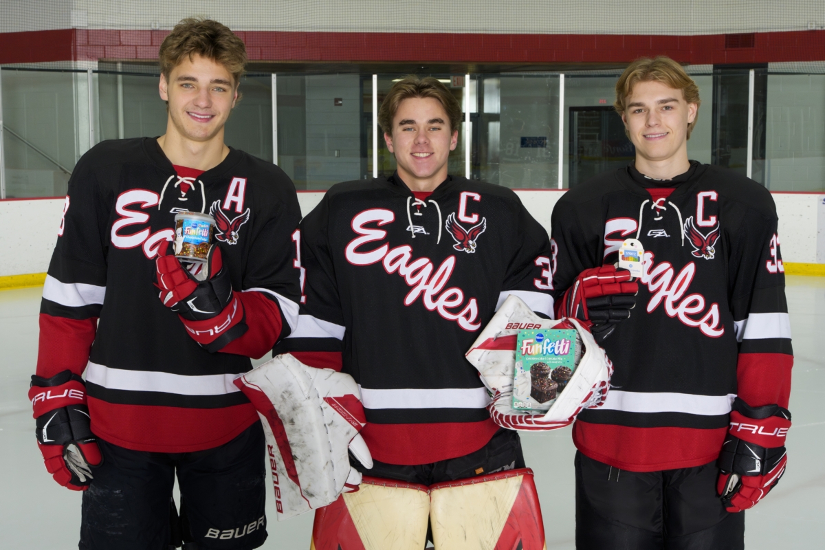 The Eden Prairie Eagles boys hockey teams will "dive" into their service project this year collection donations and assembling 200 birthday bag kits for PROP Food, which will aid local families in celebrating birthdays. Photo by Rick Olson