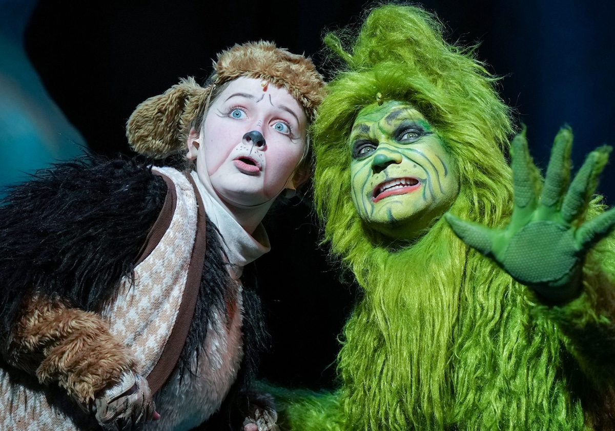 Adelyn Frost as Young Max and Reed Sigmund as the Grinch react with wide-eyed surprise during Children’s Theatre Company’s production of “How the Grinch Stole Christmas!”