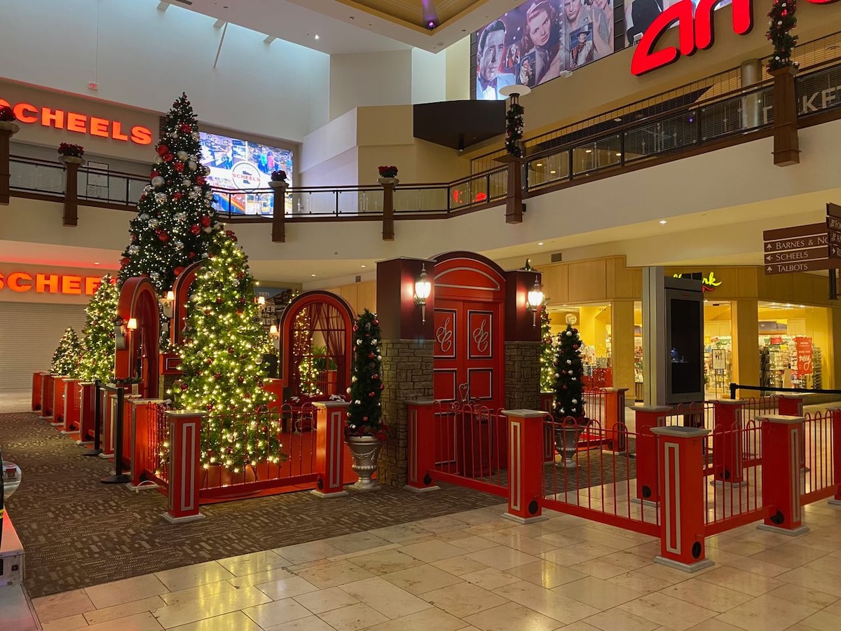Santa photo area surrounded by holiday trees and lights at Eden Prairie Center’s Scheels Court.
