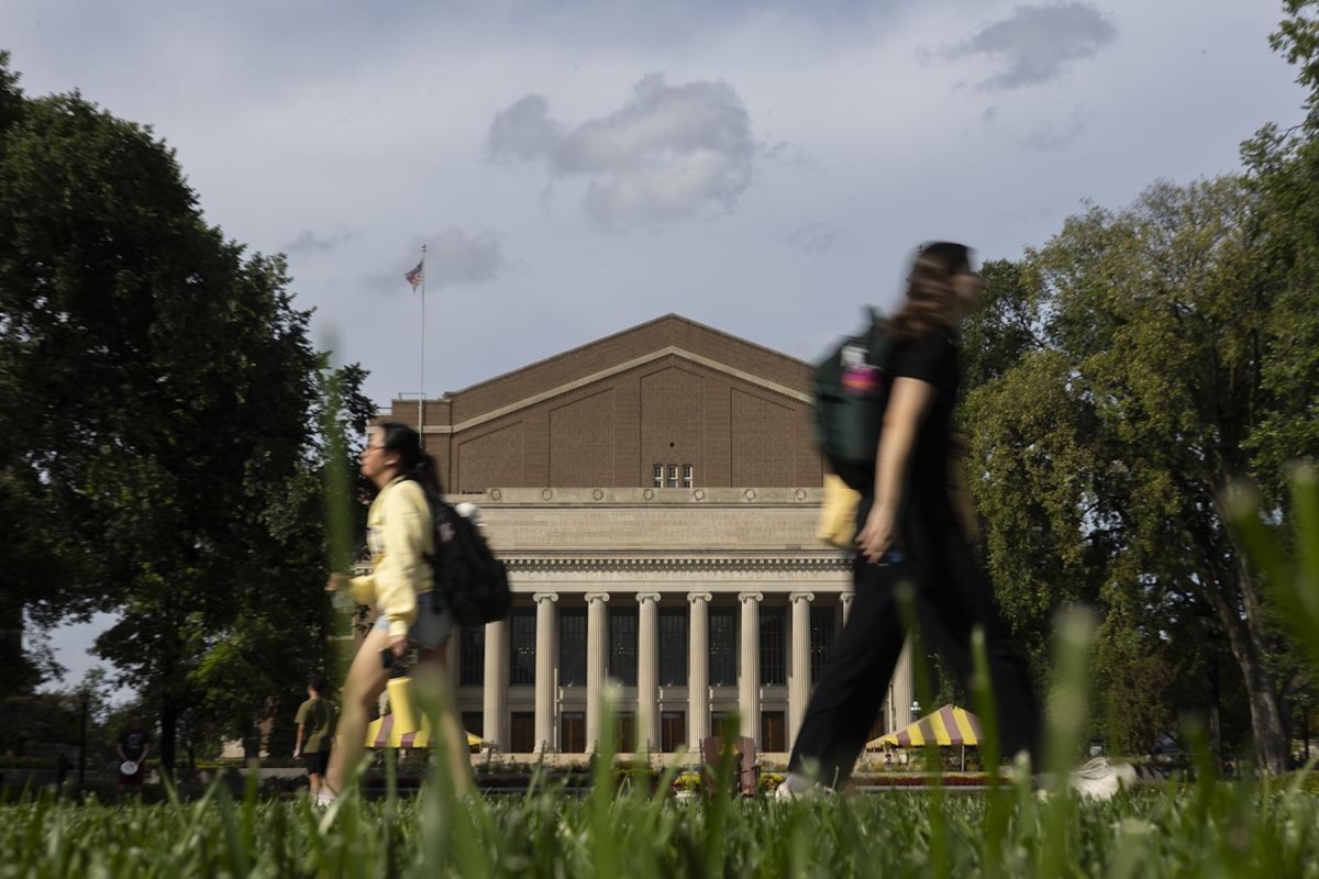 Students walk past Northrup Auditorium at the University of Minnesota campus on Thursday, Sept. 18, 2025, in Minneapolis. Photo by Ellen Schmidt/MinnPost/CatchLight/Report for America