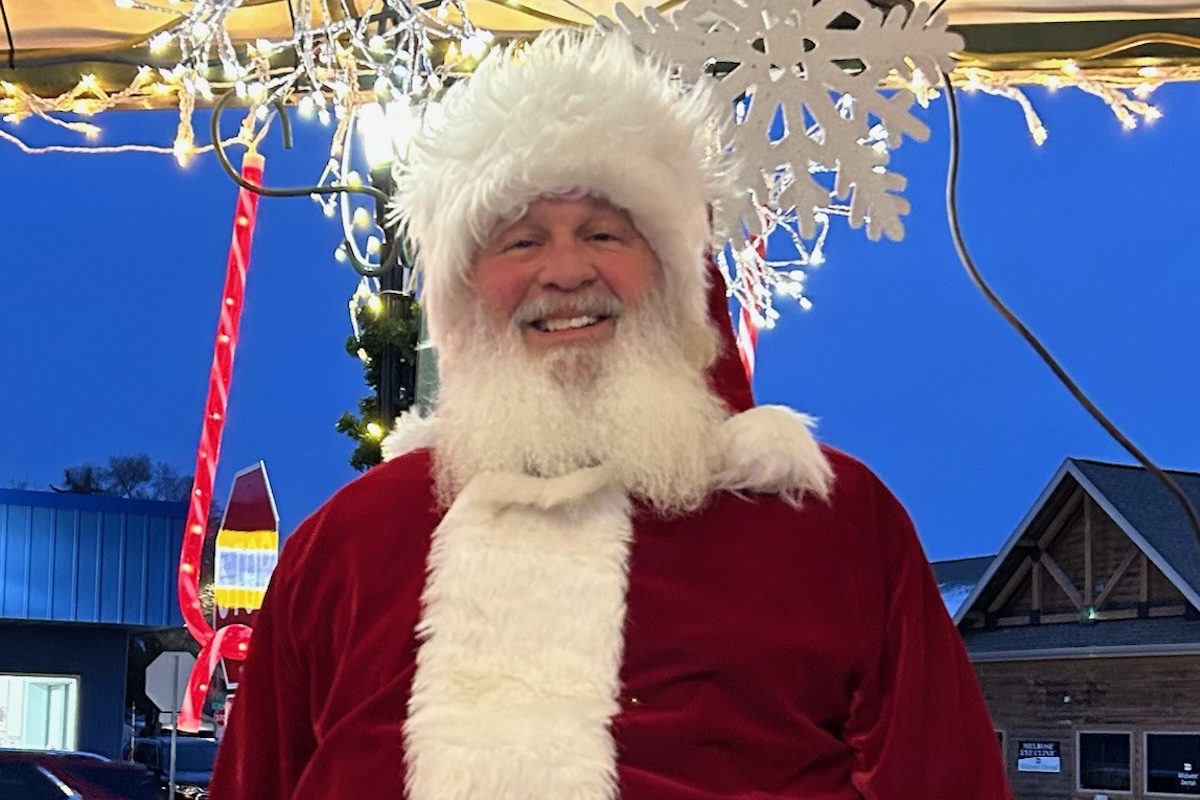 The Rev. Trish Vanni and Santa have kept in touch, and he recently sent her this photo in his seasonal garb. He will visit the Charis Ecumenical Catholic Community after Mass at noon on Dec. 21. All are welcome to stop by and say hello. Photo by Gordy Claus