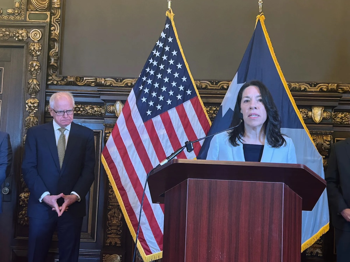 Shireen Gandhi, temporary commissioner of the Minnesota Department of Human Services, speaks at a Dec. 12 news conference at the State Capitol as Gov. Tim Walz looks on. Photo by Matthew Blake for MinnPost
